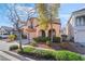 Attractive two-story home featuring a cozy balcony, archways, and low-maintenance landscaping at 2851 Glistening Grove Ave, Henderson, NV 89052