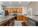 Bright kitchen with stainless appliances, wood cabinetry and light countertops at 2851 Glistening Grove Ave, Henderson, NV 89052