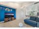 Open living space with tile flooring, access to kitchen and bright accent wall at 2851 Glistening Grove Ave, Henderson, NV 89052
