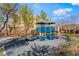 Community playground with modern play structure, seating, and mature landscaping at 2851 Glistening Grove Ave, Henderson, NV 89052