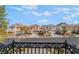 Charming street view showcasing multiple two-story homes under a bright blue sky with decorative wrought iron at 2851 Glistening Grove Ave, Henderson, NV 89052