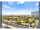 An aerial view of a neighborhood, golf course, and city skyline at 322 Karen Ave # 1507, Las Vegas, NV 89109
