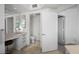 Bathroom featuring a vanity area, tiled floors, toilet, and separate door to room with carpet at 322 Karen Ave # 1507, Las Vegas, NV 89109