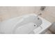 Close-up shot of a clean, white bathtub with a chrome faucet and tile surround at 322 Karen Ave # 1507, Las Vegas, NV 89109