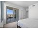Bright bedroom featuring balcony with city view, closet space and neutral decor at 322 Karen Ave # 1507, Las Vegas, NV 89109