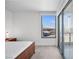 Bedroom with a bed, large windows offering great views, and access to a balcony at 322 Karen Ave # 1507, Las Vegas, NV 89109