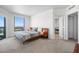 Cozy bedroom with window view, neutral decor, and an ensuite bathroom with a separate vanity at 322 Karen Ave # 1507, Las Vegas, NV 89109