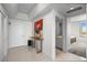 Hallway featuring a console table, artwork, and doorway leading to bathroom at 322 Karen Ave # 1507, Las Vegas, NV 89109