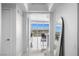 Hallway with mirror and view of the living area featuring floor-to-ceiling windows at 322 Karen Ave # 1507, Las Vegas, NV 89109