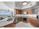 Modern kitchen featuring stainless steel appliances, granite countertops, and a view overlooking the city at 322 Karen Ave # 1507, Las Vegas, NV 89109