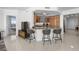 Open kitchen with breakfast bar, granite countertops, and sleek wood cabinets at 322 Karen Ave # 1507, Las Vegas, NV 89109