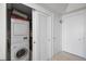 Convenient laundry closet with stacked washer and dryer, maximizing space and functionality near the entry at 322 Karen Ave # 1507, Las Vegas, NV 89109