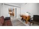 Inviting living area featuring a sleek workstation, comfortable seating, and a glimpse of the well-equipped kitchen at 322 Karen Ave # 1507, Las Vegas, NV 89109