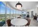 Open-concept living room and dining area featuring floor-to-ceiling windows with a panoramic city skyline view at 322 Karen Ave # 1507, Las Vegas, NV 89109