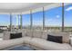Bright living room featuring a modern white sectional and stunning views of the Las Vegas skyline at 322 Karen Ave # 1507, Las Vegas, NV 89109