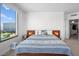 Bright main bedroom with a large window featuring city views at 322 Karen Ave # 1507, Las Vegas, NV 89109