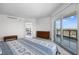 Bright main bedroom with neutral tones, a dresser, and glass doors to balcony at 322 Karen Ave # 1507, Las Vegas, NV 89109
