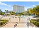 Expansive pool area with comfortable lounge chairs, tropical landscaping, and a poolside cabana at 322 Karen Ave # 1507, Las Vegas, NV 89109