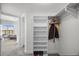 Walk-in closet with shelving and hanging rods, next to bedroom featuring a city view at 322 Karen Ave # 1507, Las Vegas, NV 89109