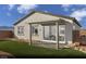 Backyard with a covered patio, low-maintenance landscaping, artificial grass, and mountain views at 325 Talladega Ct # Lot 6, Henderson, NV 89015