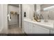 Elegant main bathroom featuring double sinks, quartz countertops, a large mirror, and a walk-in closet at 325 Talladega Ct # Lot 6, Henderson, NV 89015
