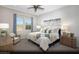 Serene main bedroom with neutral tones, stylish furnishings, soft carpet, and three decorative wall prints at 325 Talladega Ct # Lot 6, Henderson, NV 89015