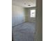 Bedroom featuring natural light with large window, awaiting finishing touches at 331 Huracan St, Pahrump, NV 89048