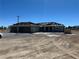 New home construction featuring a three-car garage and shingled roof on a spacious lot at 331 Huracan St, Pahrump, NV 89048