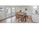 Bright dining room featuring wood table, tile flooring, and outdoor access at 3365 Zephyr Ct, Las Vegas, NV 89121