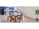 Eat-in kitchen features a wood table, tile flooring, and natural light at 3365 Zephyr Ct, Las Vegas, NV 89121
