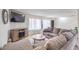Spacious living room with comfortable sectional sofa, TV, and neutral decor at 3365 Zephyr Ct, Las Vegas, NV 89121