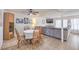 Open layout living room and dining area with a large sectional sofa at 3365 Zephyr Ct, Las Vegas, NV 89121