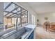 Kitchen sink with modern faucet and a view to the outdoor patio with dining at 3365 Zephyr Ct, Las Vegas, NV 89121
