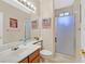 Bathroom with a shower, modern vanity, and playful artwork on the walls at 337 Glenridding St, Las Vegas, NV 89183
