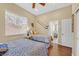 Inviting bedroom with two beds, wood floors, and plenty of natural light at 337 Glenridding St, Las Vegas, NV 89183