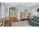 Spacious bedroom featuring hardwood floors, blue accent walls, and furniture set including dressers at 337 Glenridding St, Las Vegas, NV 89183