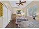 Comfortable bedroom with two beds, wood floors, closet, and decor at 337 Glenridding St, Las Vegas, NV 89183
