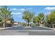 Gated community entrance surrounded by lush trees and well-maintained landscaping at 337 Glenridding St, Las Vegas, NV 89183