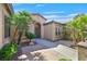 Welcoming front entrance with stone pathway and lush tropical landscaping at 337 Glenridding St, Las Vegas, NV 89183
