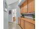Hallway with storage cabinets, decor, and views to a bathroom at 337 Glenridding St, Las Vegas, NV 89183