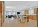 Open-concept kitchen and living room features barstool seating at island and hardwood floors in living room at 337 Glenridding St, Las Vegas, NV 89183