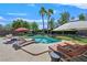 Inviting swimming pool area with lounge chairs and mature palm trees at 337 Glenridding St, Las Vegas, NV 89183