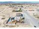 Inviting desert home with solar panels, pool and low-maintenance landscaping, surrounded by desert at 3424 Mount Charleston Dr, Pahrump, NV 89048