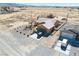 This aerial view shows the home with separate garage and mountain views at 3424 Mount Charleston Dr, Pahrump, NV 89048