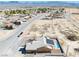 This aerial view shows home with a pool, mountain views, and neighborhood at 3424 Mount Charleston Dr, Pahrump, NV 89048