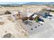 Spacious desert home with a fenced backyard, gravel landscaping, and a detached garage at 3424 Mount Charleston Dr, Pahrump, NV 89048
