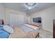 Inviting bedroom featuring carpet flooring, a fan, white trim and a door, and a television set on a table at 3424 Mount Charleston Dr, Pahrump, NV 89048