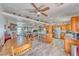 Open-concept living area featuring a kitchen, dining space, and living room with a ceiling fan at 3424 Mount Charleston Dr, Pahrump, NV 89048