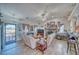 Bright living room featuring a stone fireplace, comfortable seating, and charming decor throughout at 3424 Mount Charleston Dr, Pahrump, NV 89048