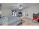 Spacious bedroom featuring wood-look flooring, ceiling fan, and a door to the backyard at 3424 Mount Charleston Dr, Pahrump, NV 89048